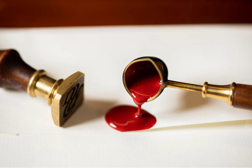 a hand pressing on the seal